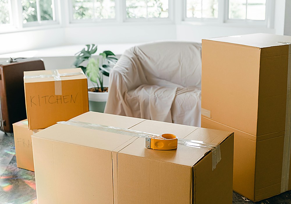 Residential moving boxes in a bright home interior